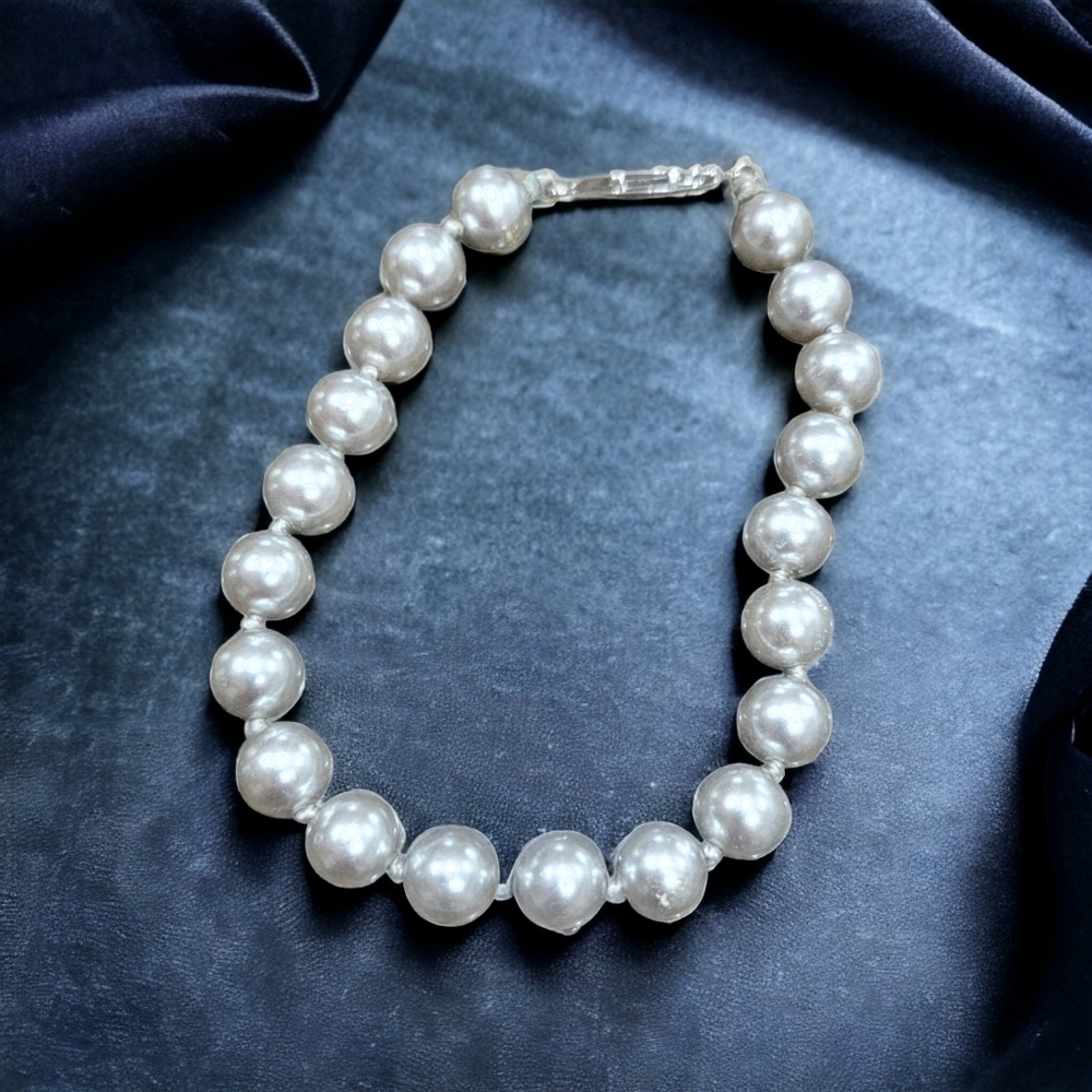 White pearl bracelet.